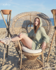 <p>Effortlessly combining comfort and chic, this look from the <em>Aurales Bohemian Collection</em> is perfect for those who enjoy lounging by the sea with a touch of bohemian elegance. The soft sage-green hooded dress drapes gently, offering both style and ease, while the playful gladiator-style sandals add a rustic, free-spirited vibe. Whether you&rsquo;re soaking up the sun or enjoying the cool ocean breeze, this outfit captures the essence of a laid-back day at the beach with a focus on natural beauty and relaxed sophistication.</p>