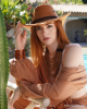 <p>Channel the earthy beauty of the desert with this effortlessly chic look from the <em>Aurales Bohemian Collection</em>. The rich terracotta tones of the outfit flow seamlessly with the natural surroundings, while the wide-brimmed hat and layered wooden jewelry evoke a sense of adventure and timeless boho style. The loose, textured fabric offers both comfort and elegance, making this the perfect ensemble for sun-soaked days by the pool or exploring exotic landscapes. With a touch of rustic charm and refined detailing, this look is for the free spirit who blends seamlessly with her surroundings.</p>